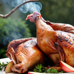**

A close-up shot of smoked chicken breasts with applewood smoke. The chicken should have a slightly reddish hue and a juicy, tender texture. Apple tree branches should be subtly visible in the background, hinting at the smoking process. Focus on capturing the appetizing and delicate nature of the dish.

**